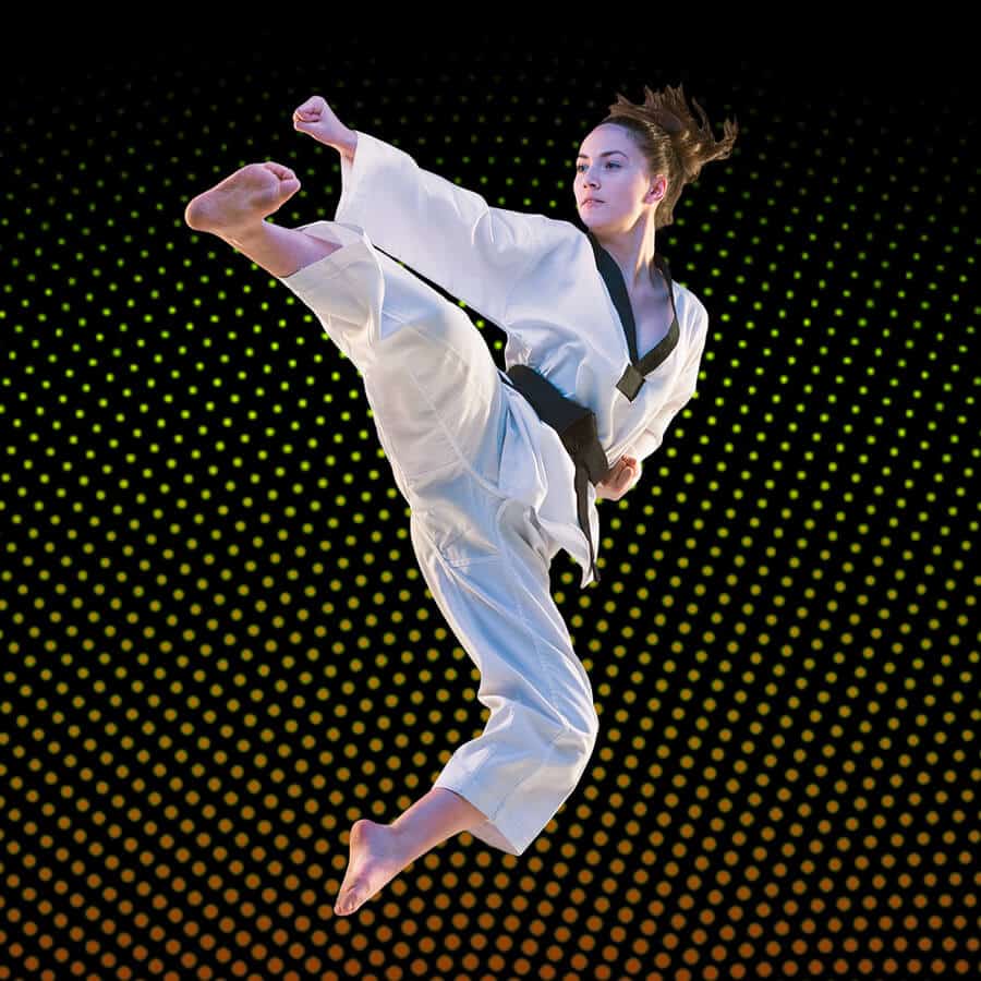 Martial Arts Lessons for Adults in Amarillo TX - Girl Black Belt Jumping High Kick