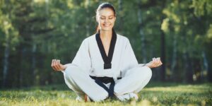 Martial Arts Lessons for Adults in Amarillo TX - Happy Woman Meditated Sitting Background